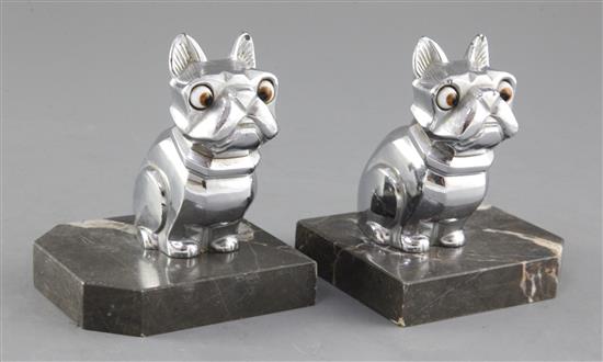 H. Moreau. A pair of Art Deco spelter bookends, modelled as a seated French Bulldog, height 4.25in.